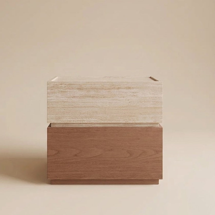 A modern two-tone wooden night stand with a travertine design top and a medium brown wood base, set against a solid beige studio background.