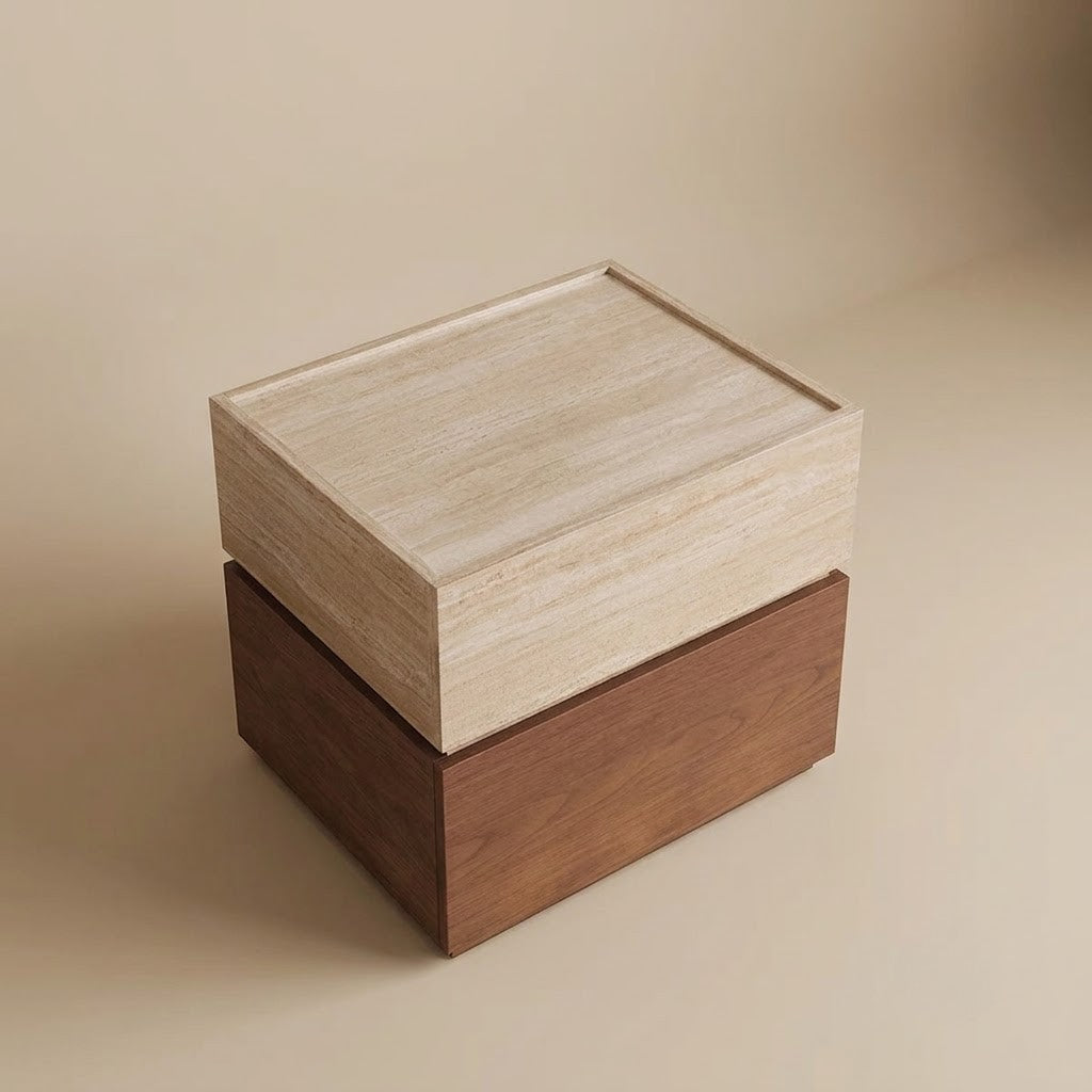A two-tone night stand with travertine-look top and a dark brown base, photographed on a warm beige studio background.