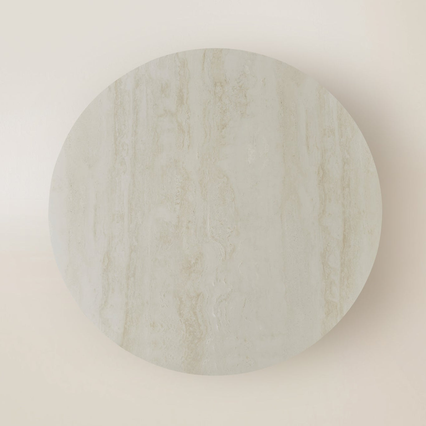 Round white travertine table top on a white background