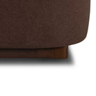 Close-up of the Lunelle Velvet Bed with a wooden base on a white background