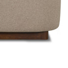 Close-up of the Lunelle Velvet Bed with a wooden base on a white background