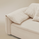 Beige sofa with cushions on a beige background
