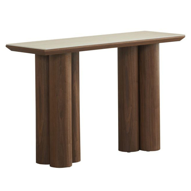Angle view of the Lyric Console table with wooden legs and a travertine sintered stone top on a white background
