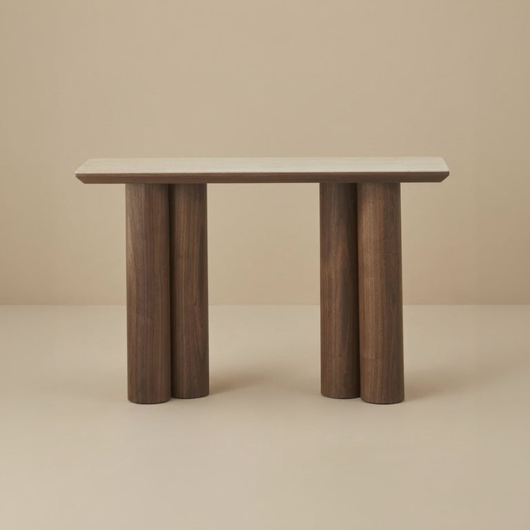 Front view of the Lyric Console table with wooden legs and a travertine sintered stone top on a beige background