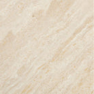 Close-up of travertine tabletop of the Lyric Console Table