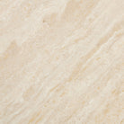 Over-head macro view of the sintered stone top highlighting the intricate tan and cream patterns that mimic natural travertine stone.