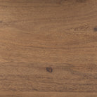 Close-up of the warm brown finish and natural wood grain on the panels of the Maddox geometric shelving unit.