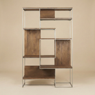 Full front view of the empty Maddox geometric shelving unit featuring an asymmetrical wood and metal frame design.