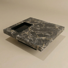 Marble-patterned coffee table on a beige background