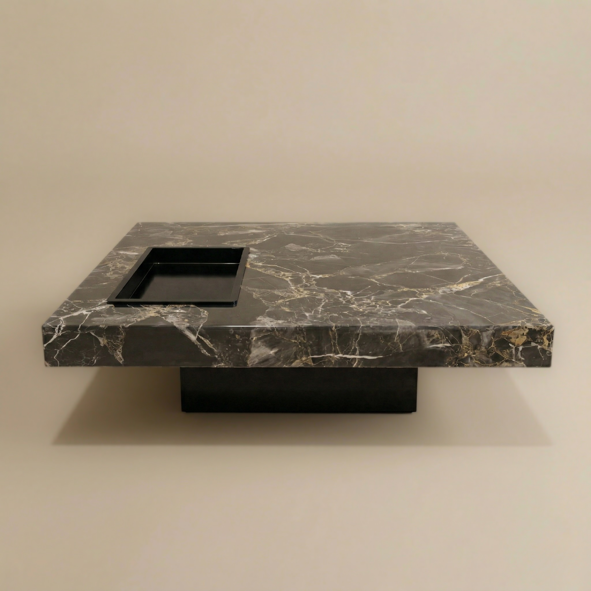 Marble pattern coffee table with a black square insert on a beige background