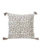 Decorative pillow with floral pattern and tassels on a white background