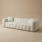 Angled studio view of the Marshmallow sofa showcasing its deep, voluminous tufted sections and low-profile silhouette.