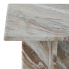 Close up of the Mesa marble side table corner, highlighting the smooth honed edge and the natural variations in the stone pattern.