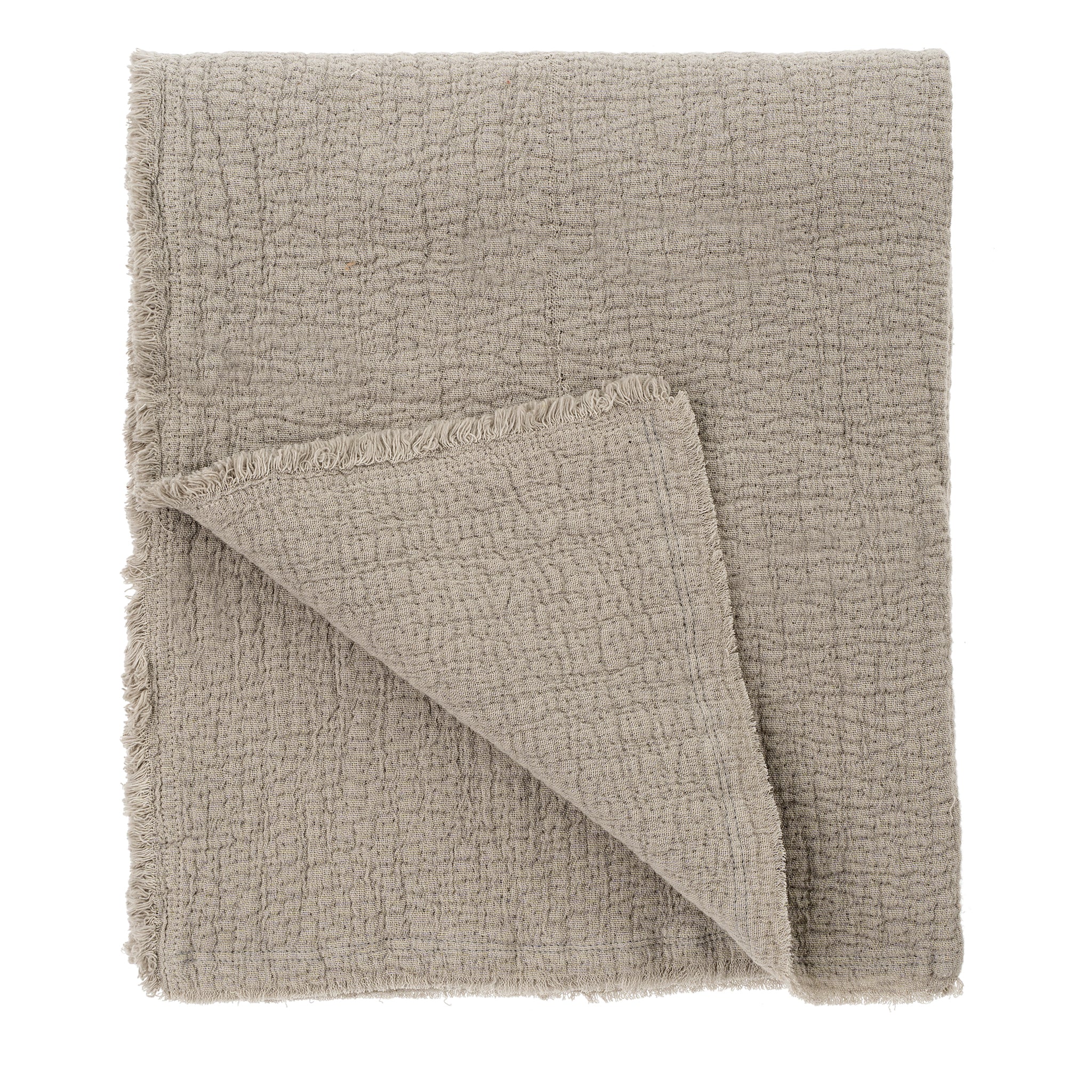 Textured beige blanket on a white background