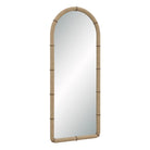 Angled view of the Mirelle Full-Length Mirror showing its tall arched form and beige vegan leather frame with antique metal band accents.
