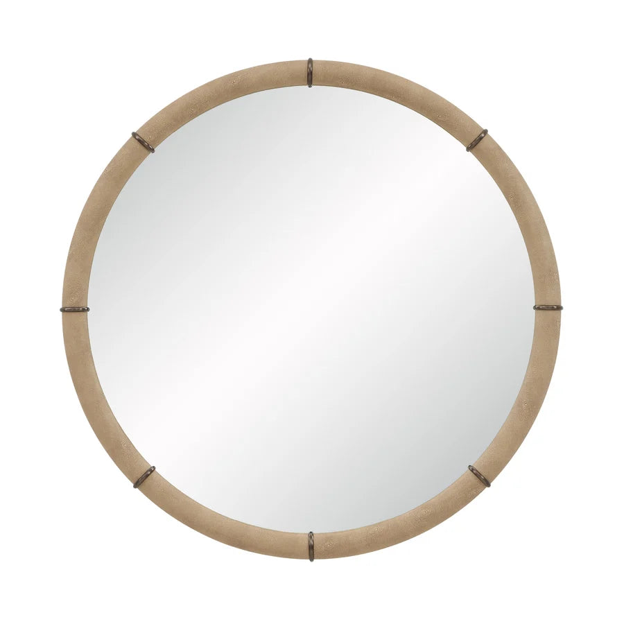 Front view of the Mirelle Round Wall Mirror with a circular silhouette, beige shagreen-textured vegan leather frame and antique metal accents.