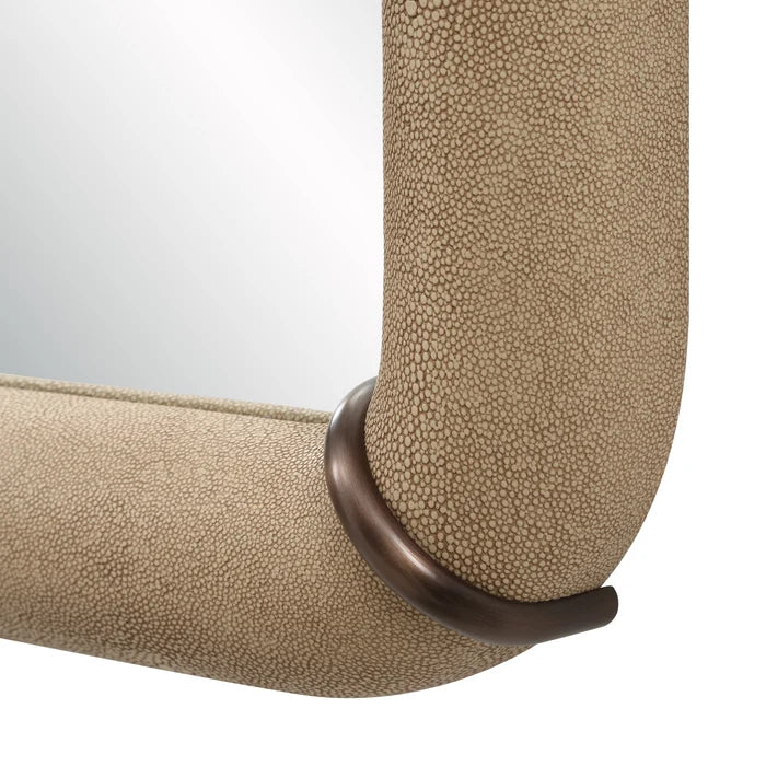 Close-up of the Mirelle Wall Mirror highlighting the beige shagreen-textured vegan leather frame and antique metal accent band.