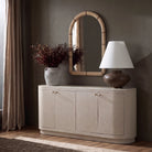Mirelle Wall Mirror styled above a console in a warm neutral interior with soft natural light.
