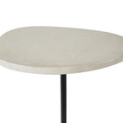 Round marble table with a black leg on a white background