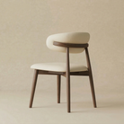 Back view of the Modern Leather Ash Wood Dining Chair revealing the elegant solid wood support bar that holds the upholstered backrest.
