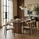 Six cream PU leather dining chairs with walnut-finished ash wood frames around a rectangular dining table featuring the Modern PU Leather Ash Wood Dining...