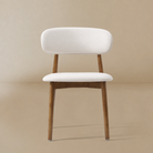 Front view of a cream PU leather dining chair with a walnut-finished ash wood frame featuring the Modern PU Leather Ash Wood Dining Side Chair