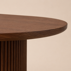 Wooden table with a beige background