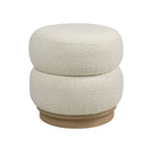 Full front view of the round Moita bouclé stool featuring a sculptural stacked cushion design in white textured fabric with a light wood base.