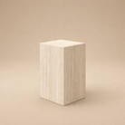The Mono Side Table, a rectangular beige travertine-look block standing 20 inches tall on a neutral background
