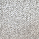 Macro close-up of the soft, speckled beige textured bouclé fabric on the Myla dining chair