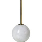Macro close-up of the Nox lamp base showcasing the polished white marble texture and natural tan veining.