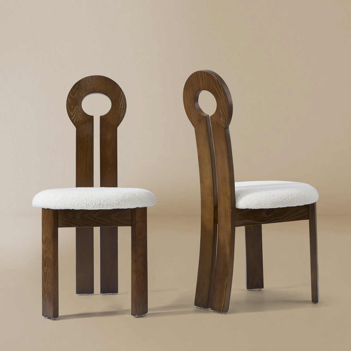 Front and angle view of the Obsidian Loop Dining Chair in a light beige studio background