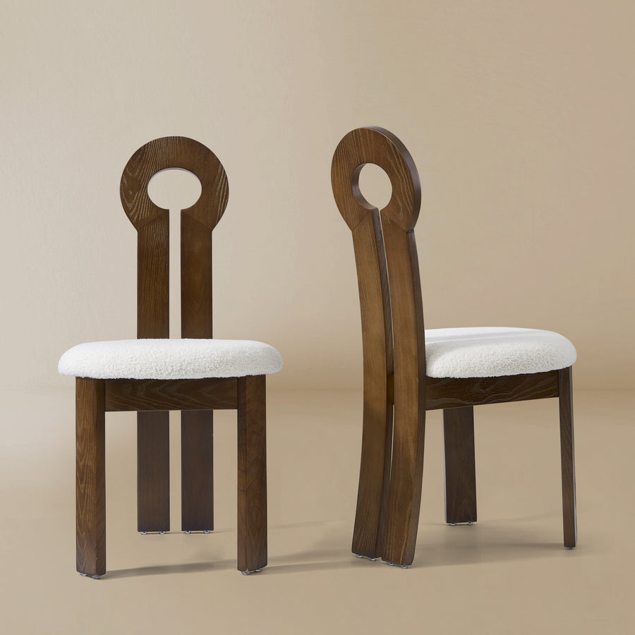 Front and angle view of the Obsidian Loop Dining Chair in a light beige studio background