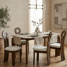 Dining room with Eclipse Elegance Dining Table and Obsidian Loop Dining Chairs on a wooden floor.