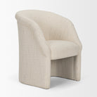 Three-quarter view of the Octavia dining armchair’s curved back and cushioned seat