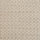 Close-up swatch of the Octavia dining armchair’s textured cream fabric