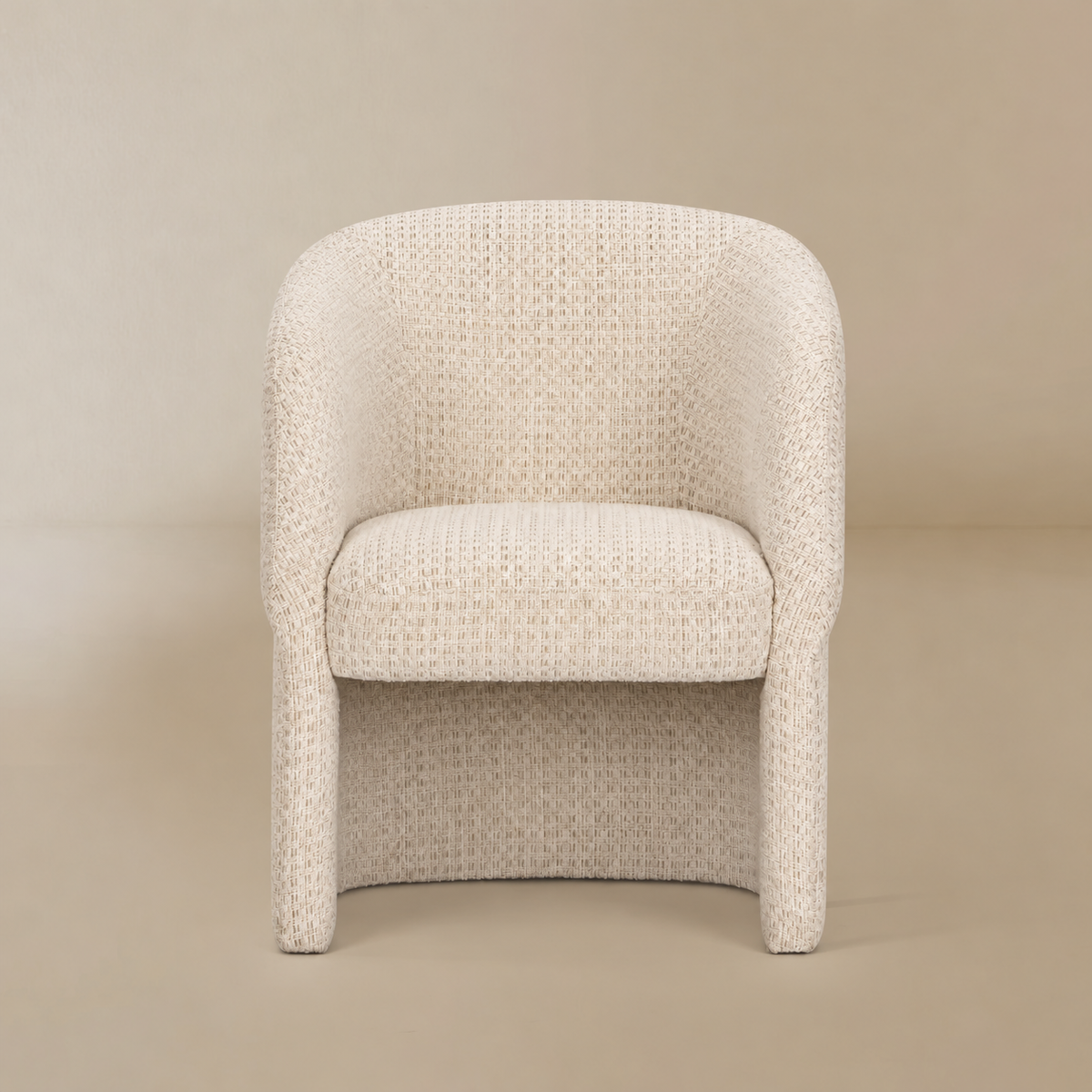 Octavia cream upholstered dining armchair on a warm beige studio background