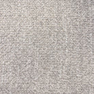 Macro close-up of the Odette chair's premium multi-tonal grey bouclé fabric showing its rich, nubby texture