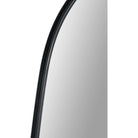 Close-up of the Orion Wall Mirror showing the slim curved black frame and reflective glass surface
