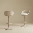 Two beige Orla adjustable swivel stools with upholstered seats, styled together on a neutral background to show different heights.