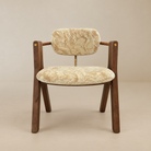 [Orsino Dining Chair] Front view showing the patterned cream-and-gold velvet seat and backrest, wood frame, wrapped armrests, and brass-toned accents.