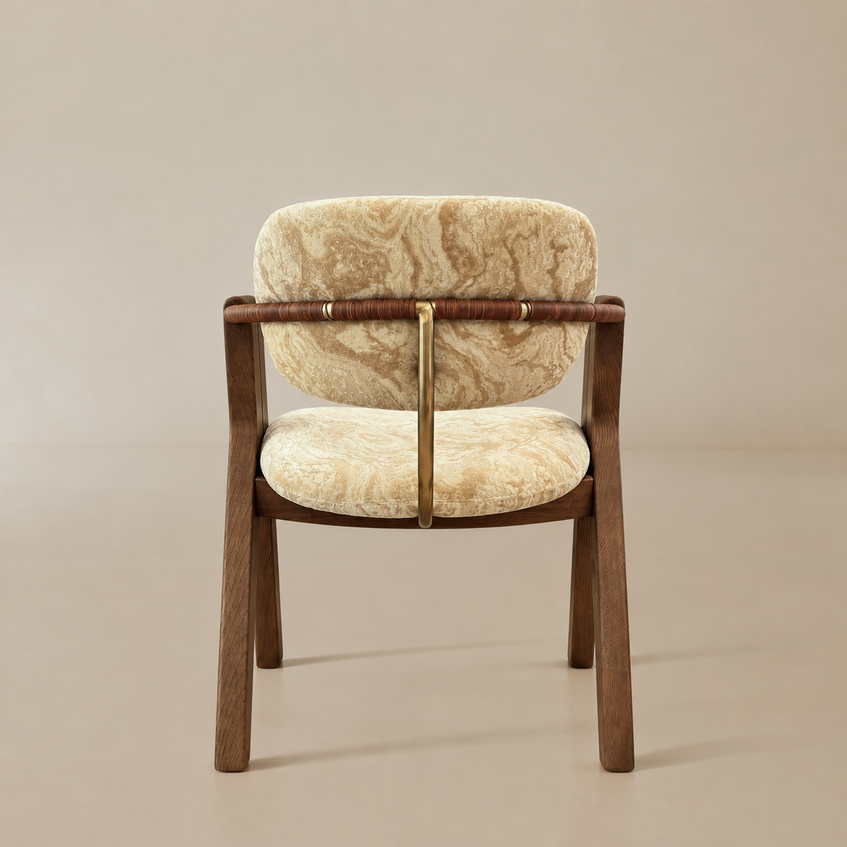 Rear view showing the rounded velvet backrest, wrapped arm rail, central brass-toned back support, and wood frame.