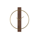 Orvella wall clock featuring a vertical walnut wood panel, an open antique brushed brass ring, and matching hands, shown from the front.
