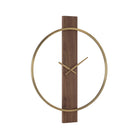 Orvella wall clock viewed at an angle, showing the open antique brushed brass ring and vertical walnut wood panel.