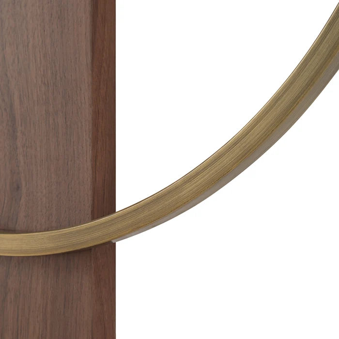 Close-up of the Orvella wall clock showing the walnut wood grain and antique brushed brass ring.