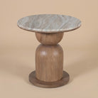 Ottilie side table with marble top on a beige background