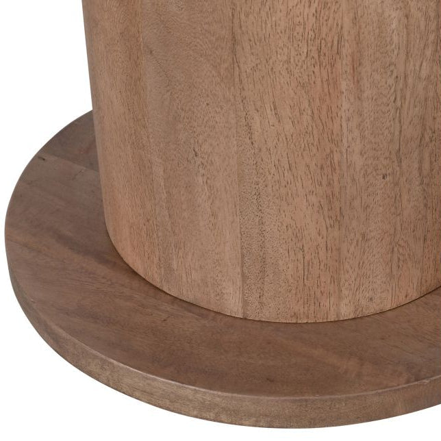 Close-up of a wooden pedestal base with a white background