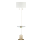 Perrin floor lamp shown in full with its antique brass frame, glass shelf, and travertine base.
