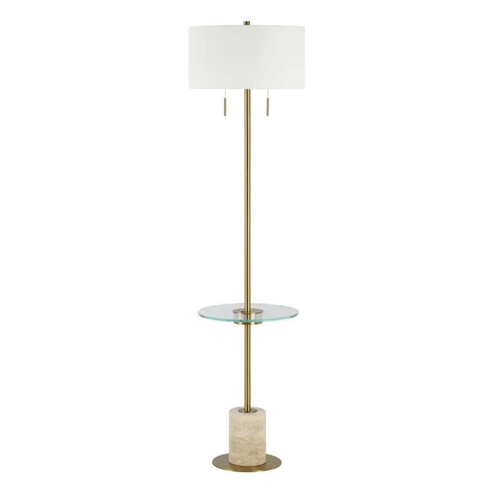 Perrin floor lamp shown in full with its antique brass frame, glass shelf, and travertine base.