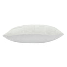 Side profile view of the plush Piper knitted checkerboard pillow showcasing its textured front and smooth fabric backing.